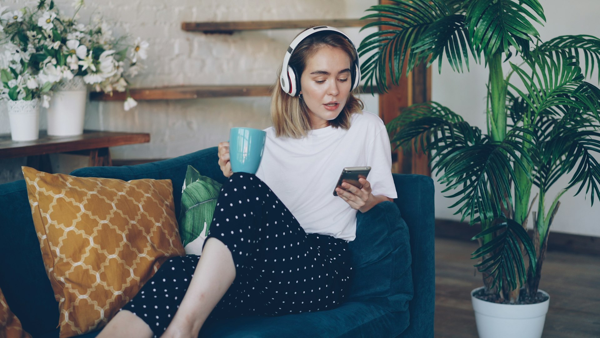 woman filing her taxes from the couch